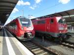 442 806 und 111 177-2 stehen hier zusammen im Bahnhof von Bamberg, 23.Juni 2013.