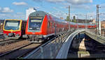 Smartphone-Aufnahme einer Begegnung zwischen einer auf Gleis 15 ausfahrenden 481-Garnitur der S-Bahn Berlin als S7 von Potsdam Hbf (S) nach Ahrensfelde (S) und auf Gleis 14 einfahrendem DBpbzfa mit