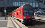 Hier eine RB14 (RB18921)  Airport-Express  von Nauen nach Berlin Schönefeld Flughafen, bei der Ausfahrt am 6.9.2014 aus Berlin Hbf. Schublok war 143 306-9.