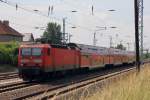 143 233-5 am 06. Juni 2011 mit einem Regionalzug (RE 7) nach Dessau kurz vor der Einfahrt in den Bahnhof Berlin Schnefeld Flughafen.