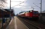 Nachschuss auf die RB nach Leipzig Hbf in Burgkemnitz. 143 879 fungiert am 05.02.09 als Schublok.