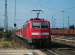 111 214 schiebt eine RB nach Bamberg am 21.August 2013 aus den Bahnhof Lichtenfels.