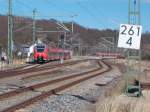 RE 13012 Sassnitz-Rostock verließ,am 05.April 2015,Lietzow während im Hintergrund der Anschlußzug nach Binz eine Stunde warten mußte.