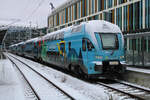 Westbahn 4010 128 im Klimaticket-Design wartet in München Hbf auf seinen weiteren Einsatz in Richtung Österreich. (26.02.2023)
