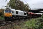 Class 66 247 038-3 mit einem Schotterzug am 26.10.2012 in Oberhausen Osterfeld.