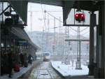 Winter in Stuttgart -    Einfahrt eines ICE 3-Zuges in den Stuttgarter Hauptbahnhof bei winterlichen Witterungsbedingungen.