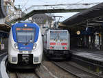 Der National Express-Elektrotriebzug 157 ist als RB48 nach Bonn-Mehlem unterwegs, der 146 572-3 geschobene IC2045 nach Dresden Hbf beim Halt am Hauptbahnhof Wuppertal.