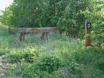 Nicht mehr genutzter Prellbock in Bergen/Rgen am 21.Mai 2011.Inzwischen liegt der Prellbock unter dem zugewachsenen Gestrpp versteckt.