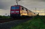 Ein RE4 Zug nach Aachen von der 111 118-6 geschoben ist hier am Bahnübergang Am Chur/In der Schley bei Wickrathhahn abgelichtet.