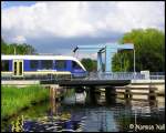 berquerung des Ems-Jade-Kanal`s kurz vor Sande eines Lint41 der NordWestBahn.31-07-2009