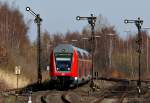 Ein RE von Puttgarden nach Hamburg Hbf am 2.04.2010 bei der Durchfahrt des Gbf von Neustadt (Holstein). 