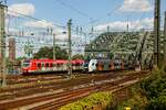 DB 423 541-3  Dr Zock kütt  Kölle & RRX 462 034 bei der Überquerung der Hohenzollernbrücke in Köln, August 2024.