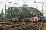 DB 423 040-5 als S19 & Eurostar 4346 nach Paris überqueren die Hohenzollernbrücke in Köln, August 2025.