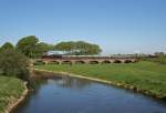 Der von 35 1097-1 gezogene Sonderzug anllich des 155jhrigen Bestehens der Eisenbahnstrecke Leipzig-Grokorbetha befhrt am Morgen des   1.05.2011 die Saalebrcke in Bad Drrenberg.