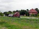 LEG 202 484-2 mit einem Kesselwagen auf der Fahrt von Karsdorf (Zementwerk) nach Bad Schandau (ber Naumburg Ost), am 03.07.2012 im Bf Laucha.