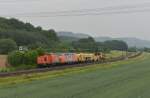 Eine Br 203 und eine V 200 mit einer Stopfmaschine am 02.06.2012 unterwegs bei Harrbach.