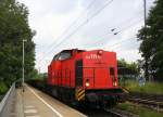 203 111-0 EBM Cargo kommt  die Kohlscheider-Rampe hoch aus Richtung Herzogenrath mit einem langen Schotterleerzug aus Neuss nach Stolberg-Hbf(Rheinland)  und fährt durch Kohlscheid in Richtung Richterich,Laurensberg,Aachen-West.
Bei Sonne und Wolken am Mittag vom 27.6.2015.