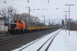 214 020 mit einem Flachwagenzug am 9.2.2010 in Kreiensen