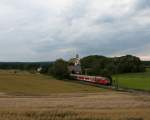 218 326-7 und 218 491-9 (am Zugende) am 4. August 2010 mit dem  Tour de Lndle  Zug bei Lffingen.
