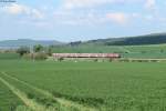 218 *** mit dem RE 14069 Hannover-Bad Harzburg in der Kurve bei Dörnten, 20.04.2014.