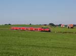 Die 218 420 mit einem RE nach Füßen am 30.08.2015 unterwegs bei Seeg.