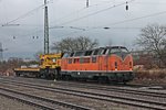 221 135-7 der Bocholter Eisenbahn Gesellschaft beim abstellen eines Bahnbau Gruppe Krupp Schwerlastkran am 17.01.2015 im Bahnhof von Müllheim (Baden).