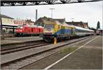 RE4228 nach Stuttgart mit 245 037 und RB92043 nach München Pasing mit ER20-013 in Lindau Hbf.