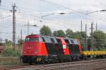 228 757-1 der Erfurter Bahnservice GmbH fhrt mit einem Bauzug durch Magdeburg-Rothensee in Richtung Norden. Fotografiert am 24.08.2010. 