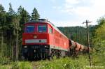 232 093-5 mit einem vollen Schotterzug im Wald bei Neukirch-West am 19.07.2011