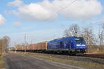 Die 246 049-2 der Press mit einem Innofreight-Container Ganzzug am 06.02.2018 in Nassenheide.