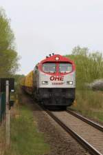 OHE 330090 Red Tiger mit Holzzug von Lbeck nach Bad Kleinen fahrend.
