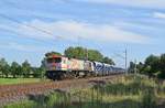 Der  Tiger  V330.3 (250 011) der HVLE zieht einen Schotterzug am 18.07.17 bei Wahnebergen in Richtung Bremen.