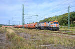 HVLE V330.2 (250 010) mit einem Getriedezug nach Mukran bei der Durchfahrt im Bahnhof Lietzow am 06.09.2022 aufgenommen.