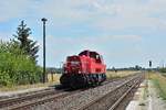 261 043-4 fährt solo durch den Haltepunkt Bernburg Friedenshall gen Bernburg.