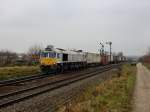 Die 247 054 am 11.11.2011 mit einem Containerzug bei der Durchfahrt in Tling.