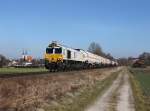 Die 247 052 mit einem Gterzug am 08.03.2013 unterwegs bei Alttting.