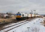 Die 247 059 mit einem Containerzug am 20.02.2012 bei der Ausfahrt aus Tüßling.