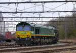 Die Class 66 266 024-9 von Railtraxx steht in Montzen-Gare(B) mit einem Güterzug aus Linz-Voestalpine(A) nach Antwerpen-Waaslandhaven(B).
Aufgenommen in Montzen-Gare(B). 
Bei wolken am Nachmittag vom 4.3.2018.