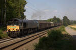 Die Class 66 266 118-9 von Railtraxx kommt mit viel Dieselpower die Gemmenicher-Rampe hochgefahren aus Richtung Aachen-West mit einem schweren gemischten Güterzug aus Linz Voestalpine(A) nach Antwerpen-Waaslandhaven(B) und am Ende fährt 185 515-4 von Railtraxx  als Schubhilfe bis zum Gemmenicher-Tunnel. 
Aufgenommen an der Montzenroute am Gemmenicher-Weg. 
Bei Sommerwetter am Nachmittag vom 2.8.2018.