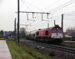 Die Class 66 DE6311  Hanna  von Crossrail kommt mit einem Silozug aus Herentals(B) nach Buna-Werke(D) und kommt aus Richtung Hasselt(B) und fährt durch Hoeselt(B) in Richtung Tongeren(B),Vise(B),Montzen(B),Aachen(D).
Aufgenommen von einem Fußgängerweg in Hoeselt(B).
Bei Regenwetter am Nasskalten Nachmittag vom 24.11.2018.