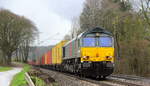 Die Class 66 DE6309 von Crossrail kommt die Gemmenicher-Rampe herunter nach Aachen-West mit einem MSC-Containerzug aus Antwerpen-Krommenhoek(B) nach Germersheim(D). Aufgenommen an der Montzenroute am Gemmenicher-Weg. 
Bei Sonne und Regenwolken am Mittag vom 5.3.2019.