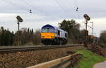 Die Class 66 653-03 von HSL-Belgium kommt als Lokzug von Aachen-West(D) nach Montzen(B) und fährt die Gemmenicher-Rampe hoch. 
Aufgenommen an der Montzenroute am Gemmenicher-Weg.
Bei Sonne und Regenwolken am Mittag vom 6.3.2019.