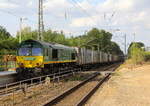 Die Class 66 266 024-9 von Railtraxx kommt als Umleiter mit einem Containerzug aus Köln-Eifeltor(D) nach Genk-Haven(B) und fährt durch Kohlscheid aus Richtung Herzogenrath und fährt die