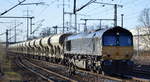 HHPI - Heavy Haul Power International GmbH, Erfurt [D] mit  653-10  [NVR:  92 80 1266 120-5 D-BRLL ] und Schüttgutwagenzug am 10.12.19 Durchfahrt Bf. Flughafen Berlin Schönefeld.