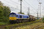 266 041-3 verlässt mit einem Kesselwagenzug Emmerich in Richtung Niederlande.