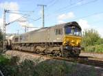 Eine Class 66 (PB 13) der Dillen & Le Jeune Cargo (DLC) kommt mit ihrem Zug aus Richtung Braunschweig. Fotografiert kurz vor Magdeburg Hbf in Hhe Platz des 17. Juni/Sachsenring am 14.08.2009