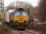 Mit voller Maschinenleistung und doch nur sehr langsam kommt am 24.02.2010 die Class66 DE 6301 von DLC mit einem schweren Containerzug auf der Montzenroute die steile kurvige Rampe von Aachen West zum