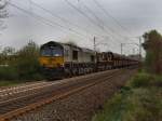 Die Class 66 29006 der HHPI am 29.04.2010 mit einem Kohlezug unterwegs bei Eystrup. 