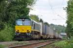 Eine grne Class 66 von Ascendos in Diensten von Crossrail zieht einen LKW-Zug die Rampe am Gemmenicher Weg hoch in Richtung Belgien. Aufgenommen am 10/07/2011.