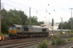 Die Class 66 DE6607 von BRLL kommt als Lokzug aus Montzen/Belgien und fhrt in Aachen-West ein bei Wolken.